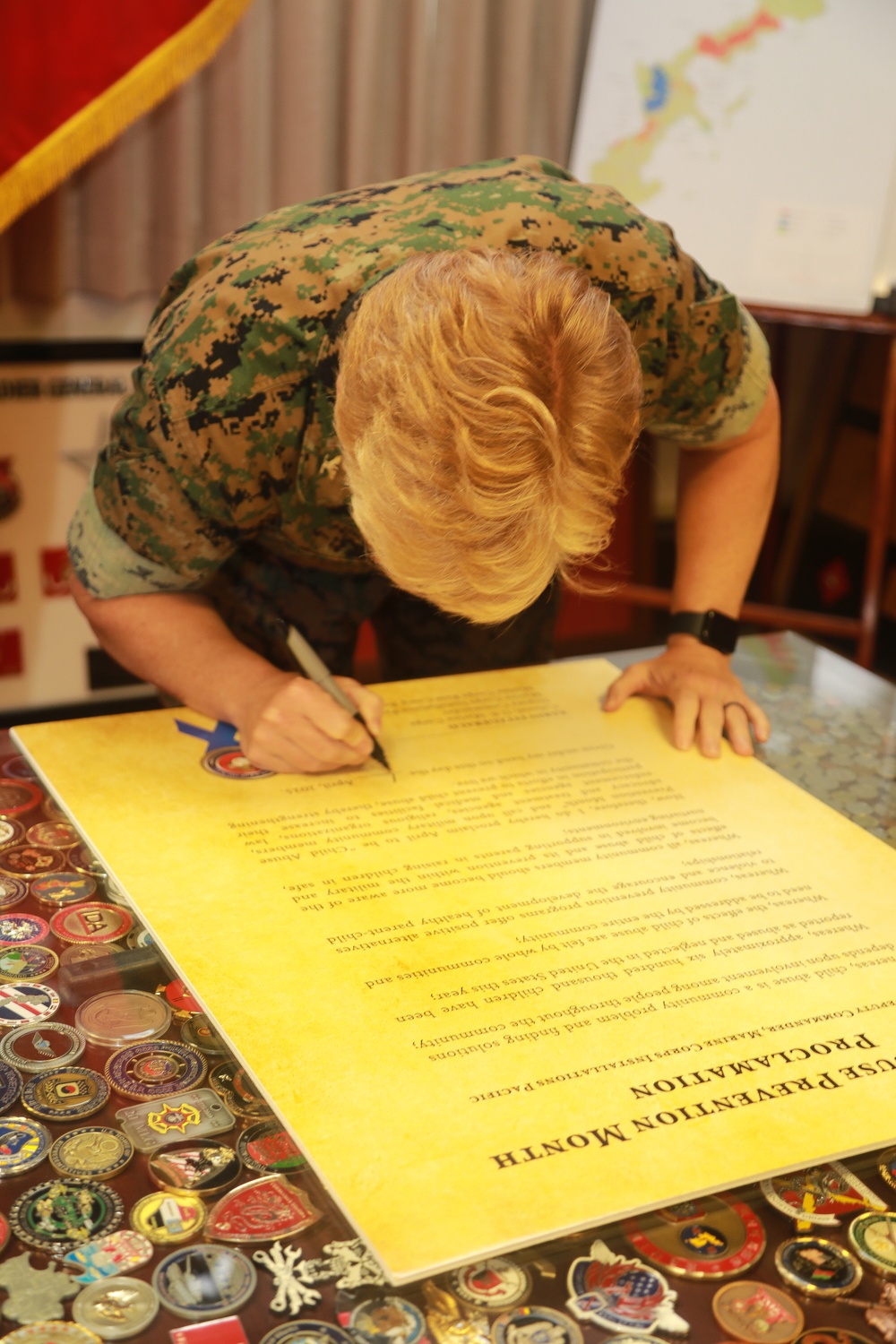 Col. Karin Fitzgerald signs the Child Abuse Prevention Month proclamation
