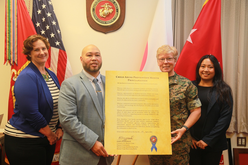 Col. Karin Fitzgerald signs the Child Abuse Prevention Month proclamation