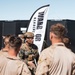 Marines sprint through the finish line during 1st Marine Division Squad Competition