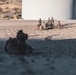 Marines sprint through the finish line during 1st Marine Division Squad Competition