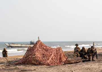 Indian Army Soldiers set up fixed positions during an amphibious landing drill