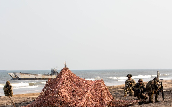 Indian Army Soldiers set up fixed positions during an amphibious landing drill