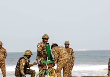 Indian Army Soldiers conduct mortar simulation during an amphibious landing drill