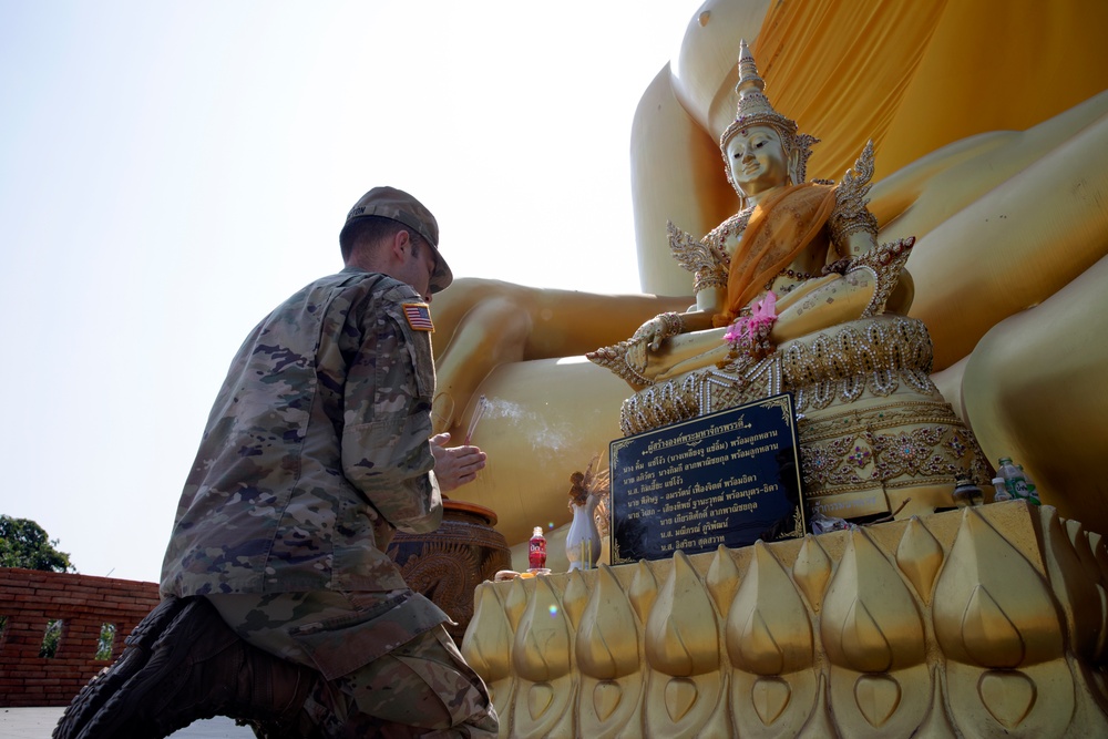 U.S. Army Reserve Captain Logan Whorton visits a Buddhist shrine near Takhli, Thailand