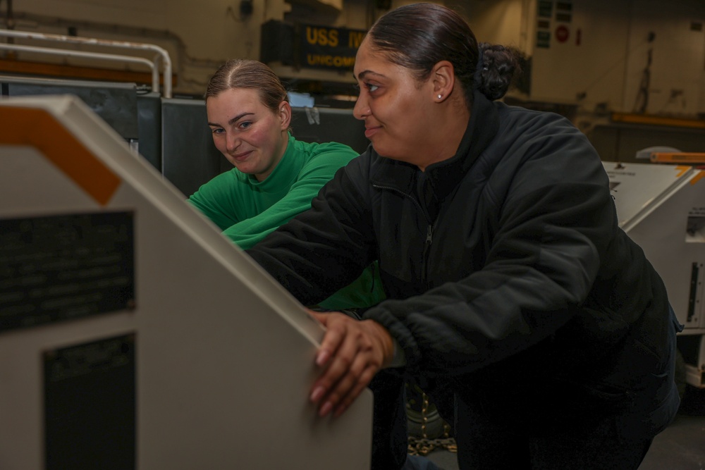 Iwo Jima Sailors move Aircraft Support Equipment For Fueling