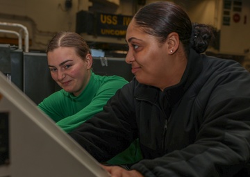 Iwo Jima Sailors move Aircraft Support Equipment For Fueling