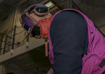 Iwo Jima Sailors move Aircraft Support Equipment For Fueling