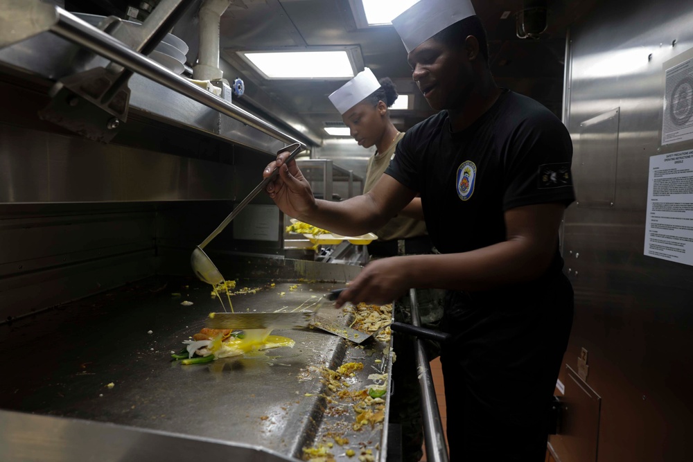 U.S. Navy Sailors prepare breakfast for the crew while in port on Naval Station Rota.