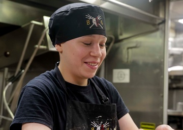 U.S. Navy Sailor prepares lunch for the crew while in port on Naval Station Rota.