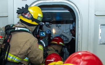 USS Ronald Reagan (CVN 76) conducts a joint damage control drill
