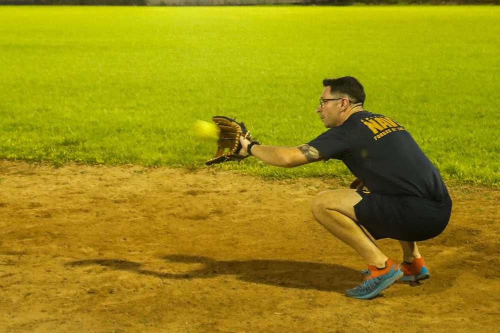 Sailors compete against Soldiers in a Navy vs. Army softball game during Navy Week in Pago Pago, American Samoa