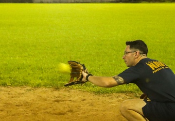 Sailors compete against Soldiers in a Navy vs. Army softball game during Navy Week in Pago Pago, American Samoa