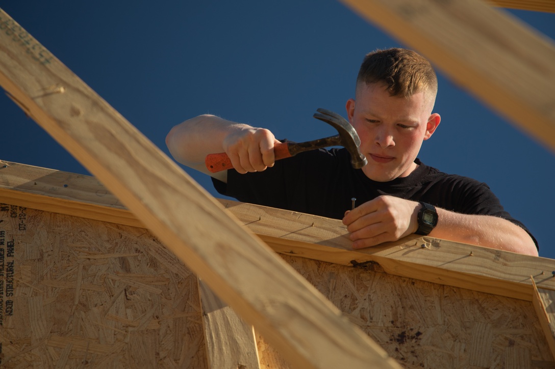 U.S. Marine Lance Cpl. John Bechtold, an intelligence specialist with the 24th Marine Expeditionary Unit (MEU), volunteers with the Habitat for Humanity foundation in Wilmington, N.C., April 16, 2025. 24th MEU Marines and Sailors volunteer with different organizations to give back to local communities and build relationships. (U.S. Marine Corps photo by Cpl. Victoria Hutt)