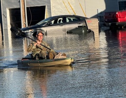 EOD platoon sergeant uses kayak to deliver groceries to family stranded after floods