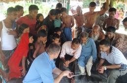 Stan Wharry, former chief of USACE - Alaska District’s Asia Programs Office, converses with locals in Bangladesh during a preliminary site visit in 2010