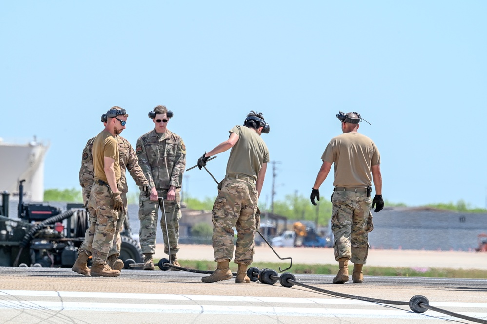 7th CES Airmen install Mobile Aircraft Arresting System in preparation for Wings Over West Texas Airshow
