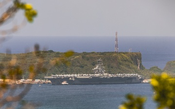 USS Nimitz (CVN 68) pulls into Guam for a port visit