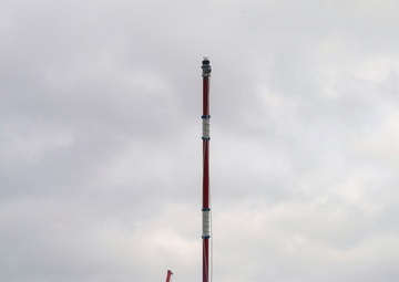 U.S. Navy Sailors rig the jack staff while pulling into Naval Station Rota, Spain.