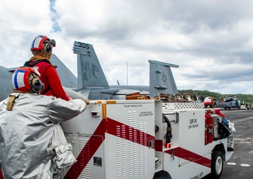 USS Nimitz Departs Naval Base Guam