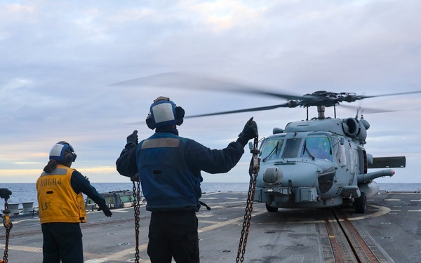 USS Bulkeley ground crew deploy a MH-60R Sea Hawk helicopter.