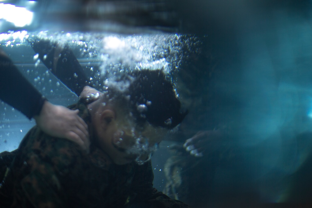 Sink or Swim: U.S. Marines with MWSS-171 swim in preparation for egress training.