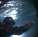 Sink or Swim: U.S. Marines with MWSS-171 swim in preparation for egress training.