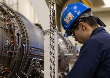 Ford Sailors Conduct Maintenance on a Jet Engine