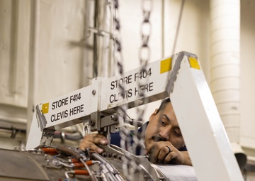 Ford Sailors Conduct Maintenance on a Jet Engine