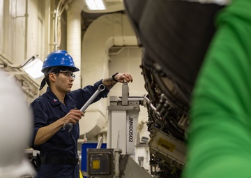 Ford Sailors Conduct Maintenance on a Jet Engine