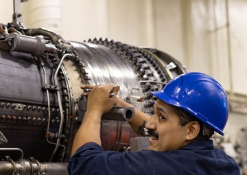 Ford Sailors Conduct Maintenance on a Jet Engine