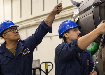 Ford Sailors Conduct Maintenance on a Jet Engine