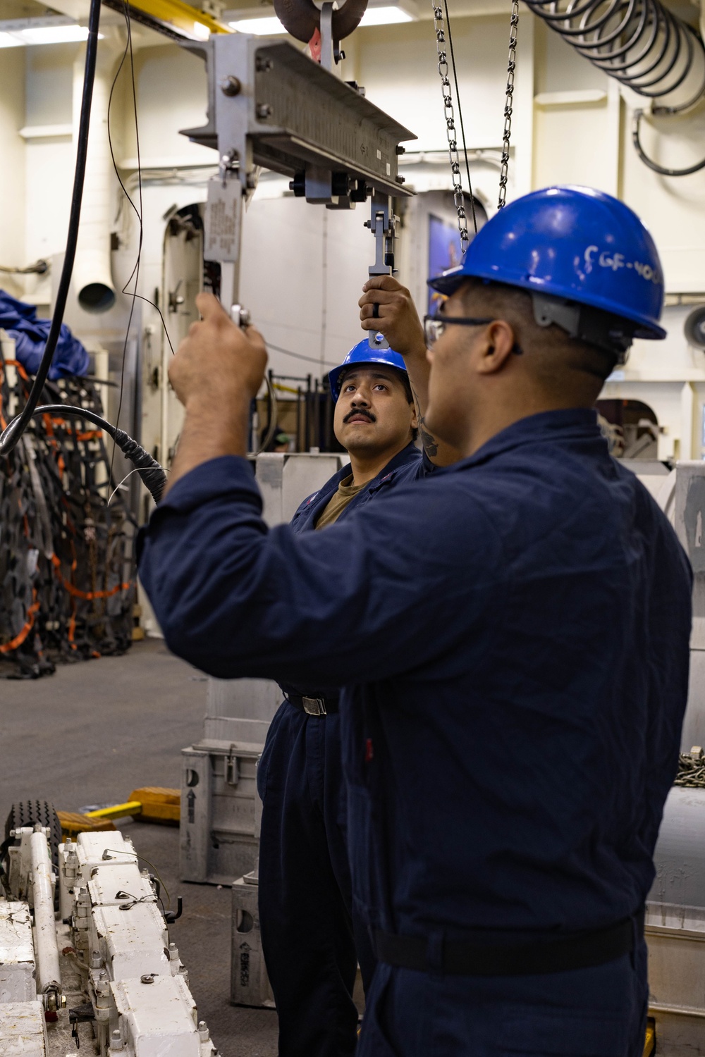 Ford Sailors Conduct Maintenance on a Jet Engine