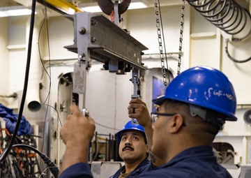 Ford Sailors Conduct Maintenance on a Jet Engine