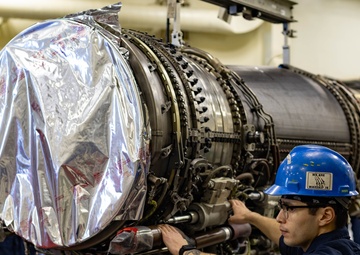 Ford Sailors Conduct Maintenance on a Jet Engine