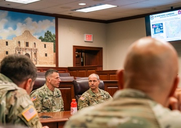 U.S. Army North Commander speaks with the 160th Special Operations Aviation Regiment