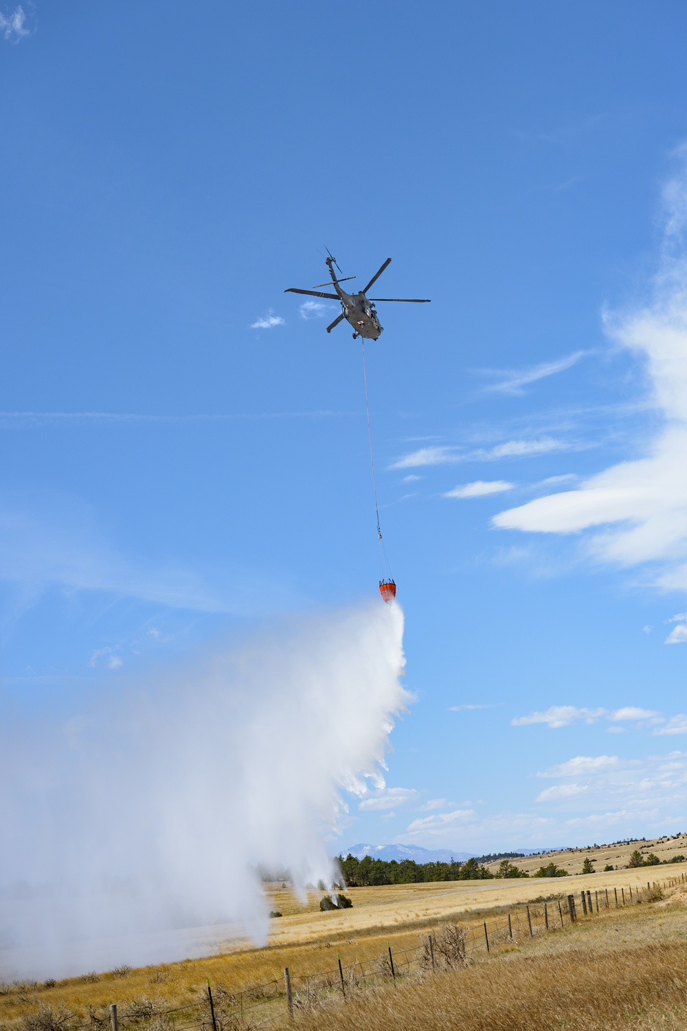 Wyoming Guard Aviators Sharpen Wildfire Response Skills in Interagency Bucket Drop Training
