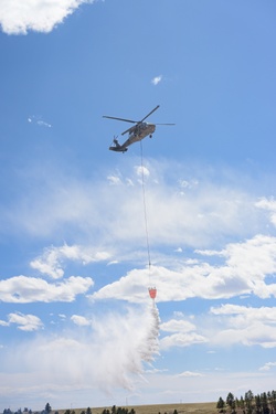 Wyoming Guard Aviators Sharpen Wildfire Response Skills in Interagency Bucket Drop Training