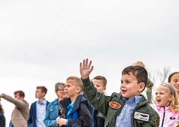 Friends and family celebrate a service members career
