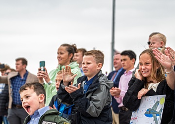 Friends and family celebrate a service members career