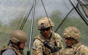 Soldiers explain the technology behind the flow of fire missions to the gun line