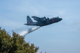 Watering Trees: A C-130 (MAFFS 9) from Nevada Air National Guard's 152nd Airlift Wing performs a water drop April 24, 2025, during Modular Airborne Fire Fighting System (MAFFS) Spring Training 2025