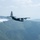 A C-130 (MAFFS 5) from the United States Air Force Reserve's 302nd Airlift Wing out of Colorado Space Force Base performs a water drop April 24, 2025, during Modular Airborne Fire Fighting System (MAFFS) Spring Training 2025