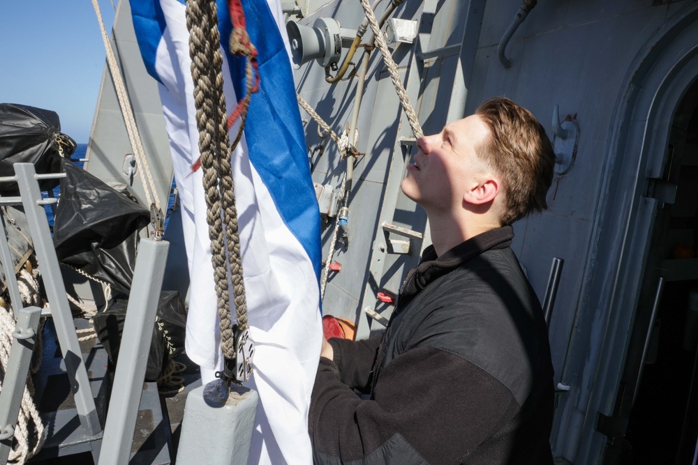 Quartermaster raises the church pennant