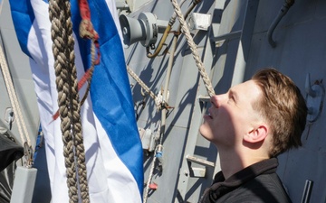 Quartermaster raises the church pennant