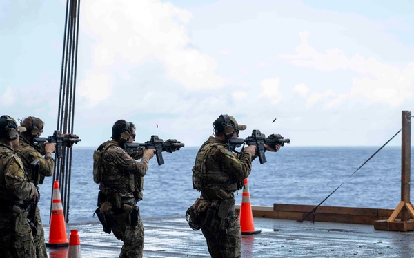 Nimitz Sailors Participate In Small Arms Gun Shoot