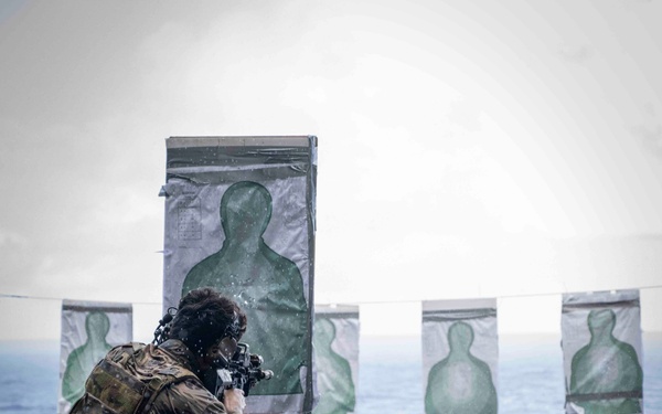 Nimitz Sailor Participates In Small Arms Gun Shoot