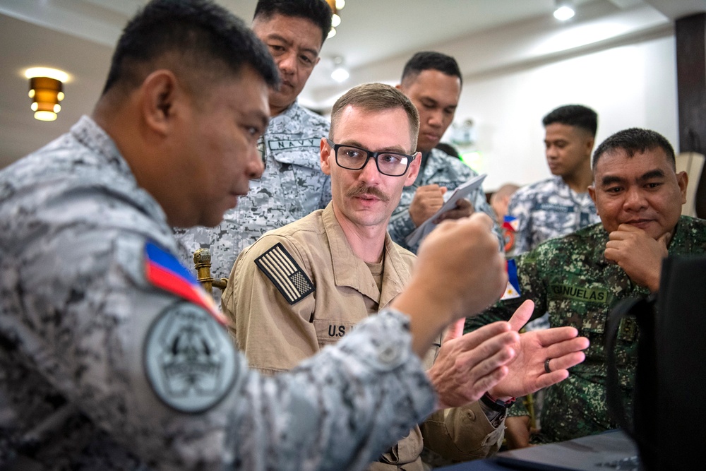 Balikatan 25: U.S. Navy Conducts a Joint Final Briefing of Continual Operations During a Multilateral Maritime Exercise