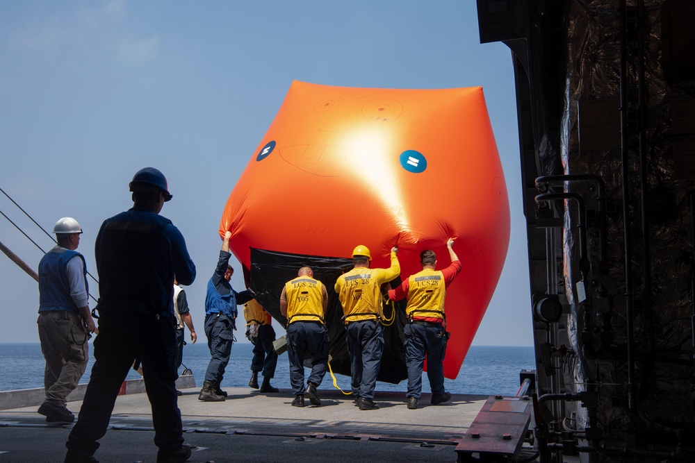 Balikatan 25: USS Savannah (LCS 28) Sailors Rolls-Out Floating Gunnery Exercise Target