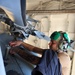 Aviation Structural Mechanic 2nd Class Taylor Gala Rodríguezes conducts pre-flight maintenance