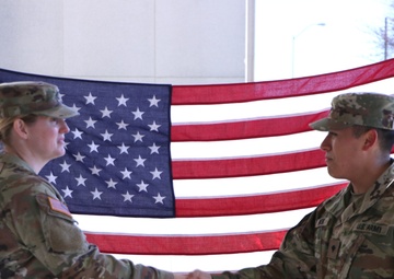 SPC Luis Pintor reenlists in front of USAMRIID